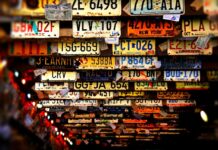 What does the color of the license plates on vehicles mean?