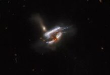 3 galaxies are torn apart in this Hubble image