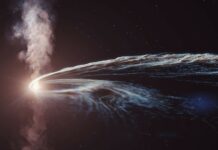 A black hole is 'vomiting' material from a star it devoured years ago